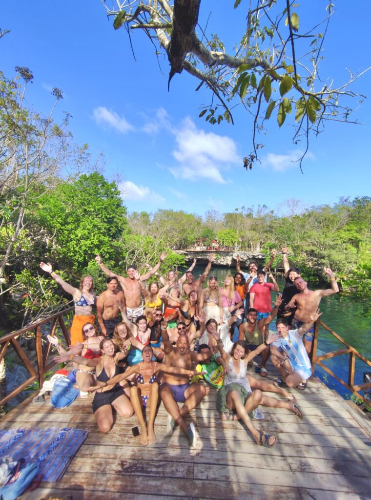 a group of friends visiting a cenote in mexico